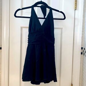 Carol Wior black one piece slim suit with attached skirt. Size 8.
